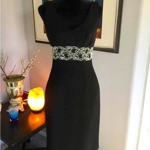 Mica Little black dress size 2. white lacy intricate design around the waist